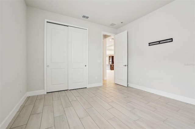 2785 Park Ridge St, Apopka, FL 32712 - unfurnished bedroom featuring light wood-style flooring and a closet
