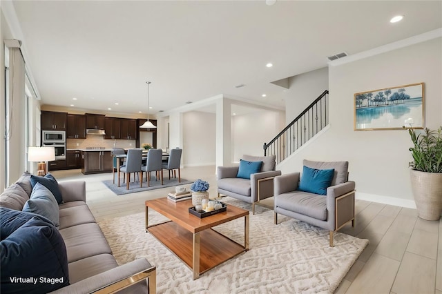 2785 Park Ridge St, Apopka, FL 32712 - living room featuring recessed lighting, light wood-style flooring, and stairs
