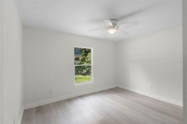 239 S Lake Cortez Dr, Apopka, FL 32703 - empty room with wood finished floors, a ceiling fan, and baseboards