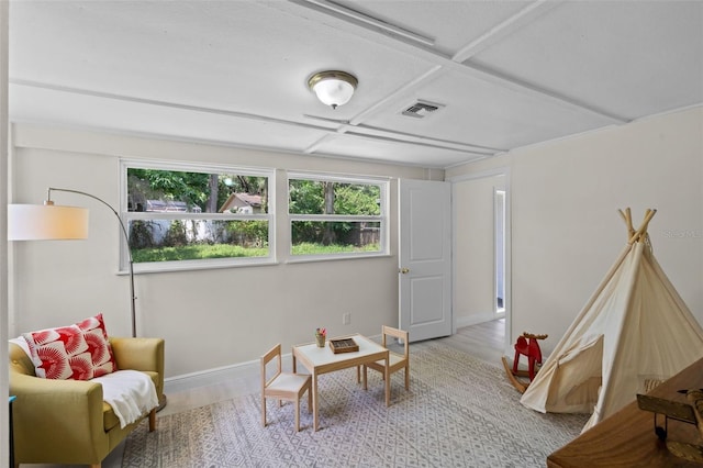 239 S Lake Cortez Dr, Apopka, FL 32703 - living area featuring healthy amount of natural light, wood finished floors, coffered ceiling, and baseboards