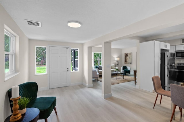 239 S Lake Cortez Dr, Apopka, FL 32703 - entrance foyer featuring light wood finished floors and baseboards