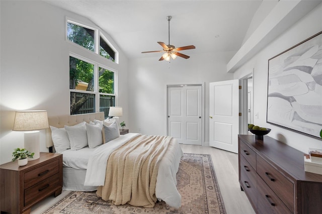 239 S Lake Cortez Dr, Apopka, FL 32703 - bedroom featuring light wood-type flooring, high vaulted ceiling, and a ceiling fan