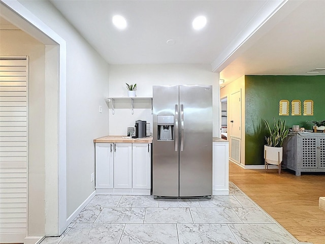 1121 49th Ave N, Saint Petersburg, FL 33703 - kitchen with marble finish floor, open shelves, recessed lighting, and stainless steel refrigerator with ice dispenser