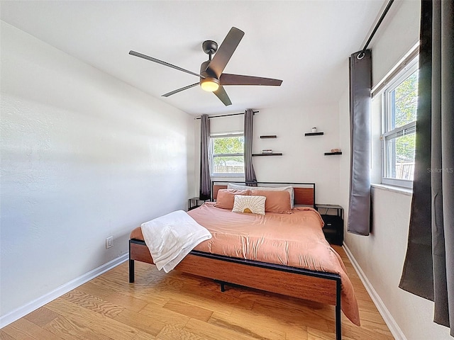 1121 49th Ave N, Saint Petersburg, FL 33703 - bedroom with light wood-style flooring, baseboards, and ceiling fan