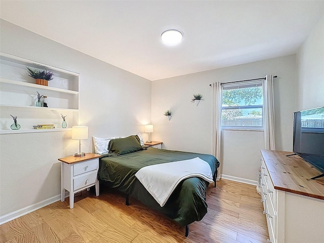 1121 49th Ave N, Saint Petersburg, FL 33703 - bedroom with baseboards and light wood finished floors