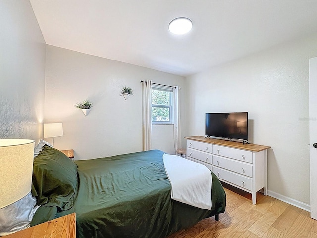 1121 49th Ave N, Saint Petersburg, FL 33703 - bedroom with baseboards and light wood finished floors