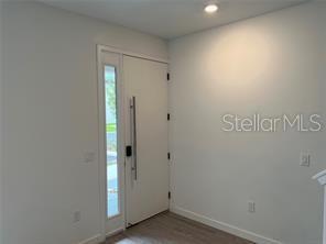 3296 Tranquil Trl, Kissimmee, FL 34747 - foyer entrance with baseboards, recessed lighting, and wood finished floors
