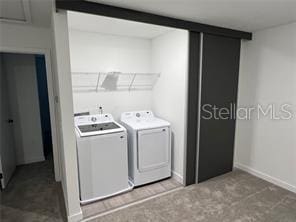 3296 Tranquil Trl, Kissimmee, FL 34747 - washroom with separate washer and dryer and baseboards