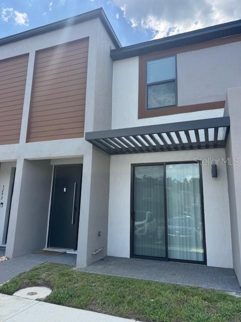3296 Tranquil Trl, Kissimmee, FL 34747 - view of front of house with stucco siding