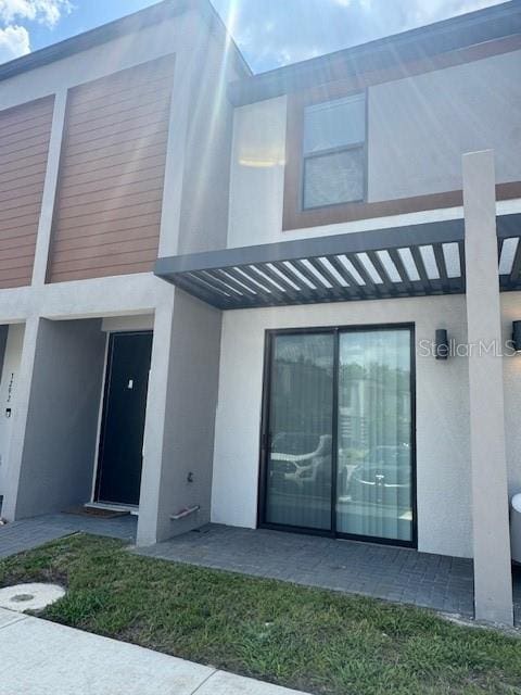 3296 Tranquil Trl, Kissimmee, FL 34747 - rear view of house with stucco siding