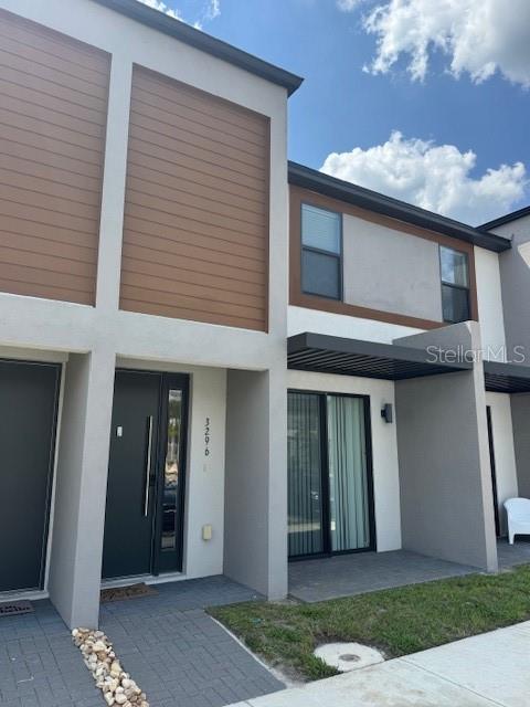 3296 Tranquil Trl, Kissimmee, FL 34747 - back of property featuring stucco siding