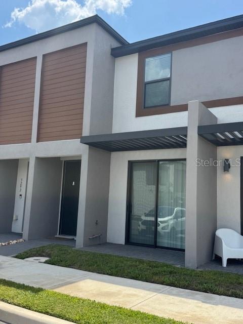 3296 Tranquil Trl, Kissimmee, FL 34747 - view of front facade featuring stucco siding