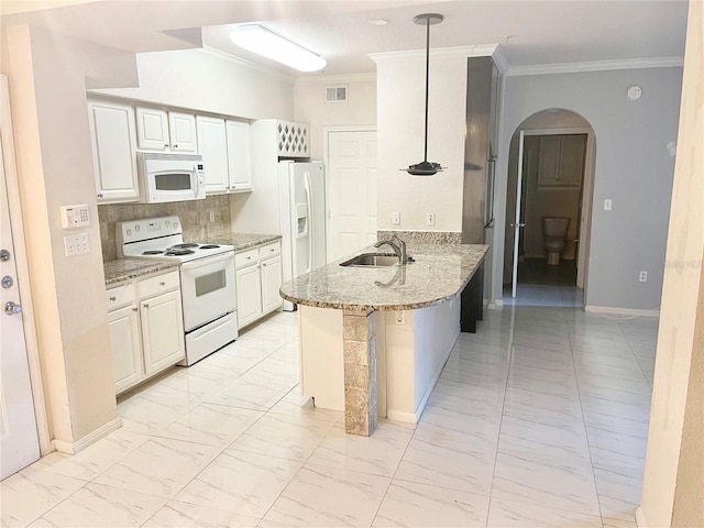 911 N Orange Ave Unit 424, Orlando, FL 32801 - kitchen featuring a sink, a peninsula, marble finish floor, white appliances, and visible vents
