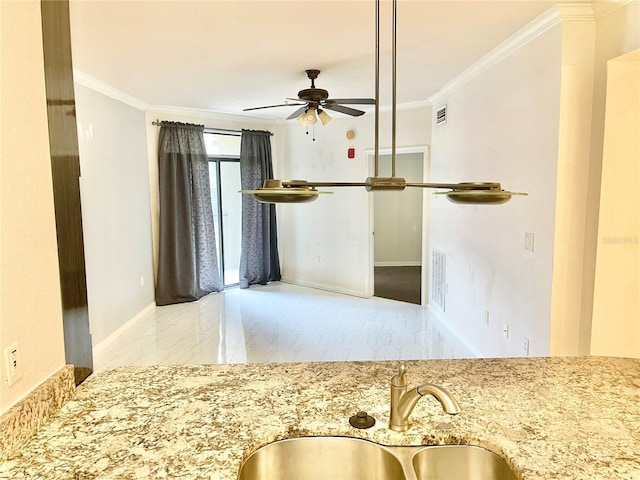 911 N Orange Ave Unit 424, Orlando, FL 32801 - kitchen with a sink, light stone countertops, marble finish floor, ceiling fan, and ornamental molding
