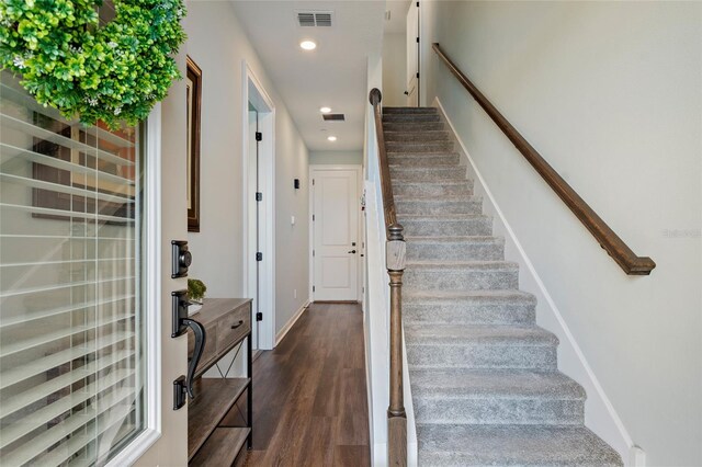 12330 Koshiba Aly, Orlando, FL 32827 - staircase with baseboards, visible vents, wood finished floors, and recessed lighting