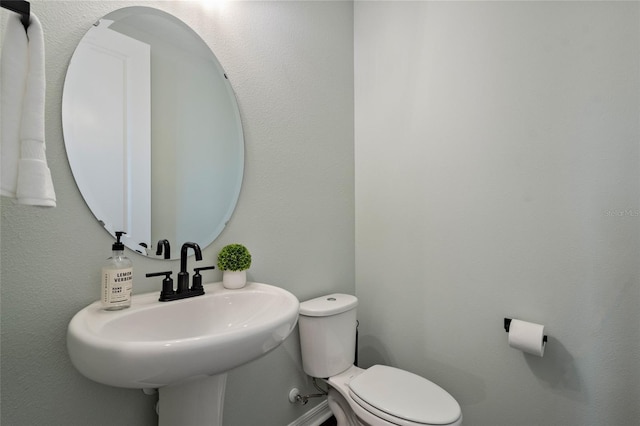 12330 Koshiba Aly, Orlando, FL 32827 - half bathroom featuring a sink and toilet