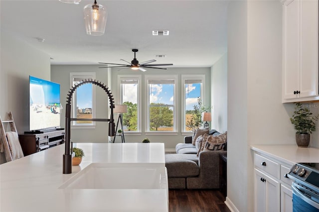 12330 Koshiba Aly, Orlando, FL 32827 - kitchen featuring dark wood-style flooring, white cabinets, visible vents, a ceiling fan, and a sink