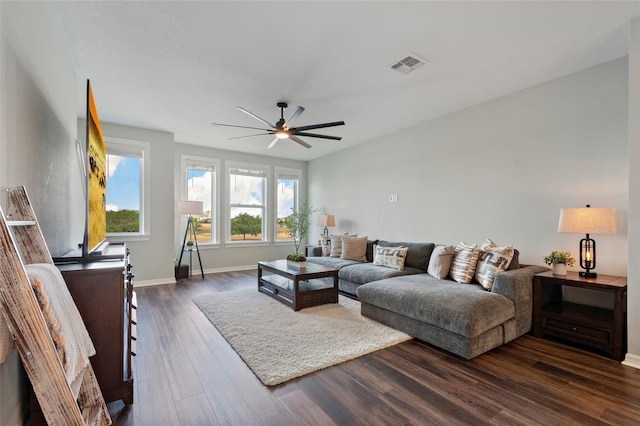 12330 Koshiba Aly, Orlando, FL 32827 - living area featuring baseboards, dark wood-style flooring, visible vents, and a ceiling fan