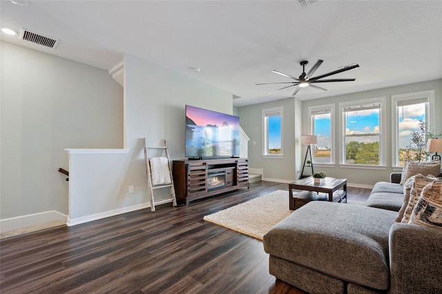 12330 Koshiba Aly, Orlando, FL 32827 - living room featuring dark wood finished floors, baseboards, visible vents, and a ceiling fan
