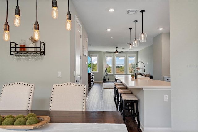 12330 Koshiba Aly, Orlando, FL 32827 - dining room with recessed lighting, dark wood-type flooring, baseboards, visible vents, and a ceiling fan