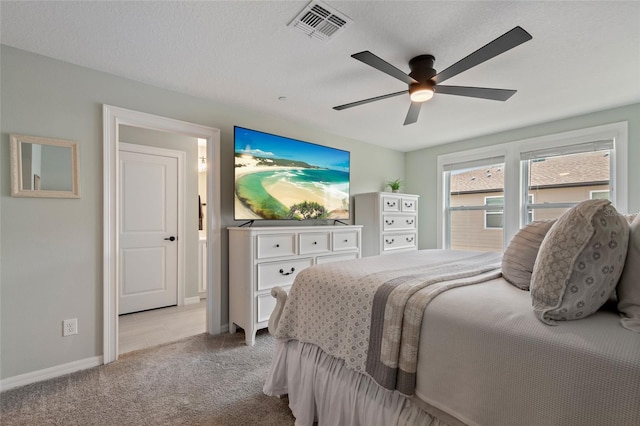 12330 Koshiba Aly, Orlando, FL 32827 - carpeted bedroom featuring baseboards, a textured ceiling, visible vents, and a ceiling fan