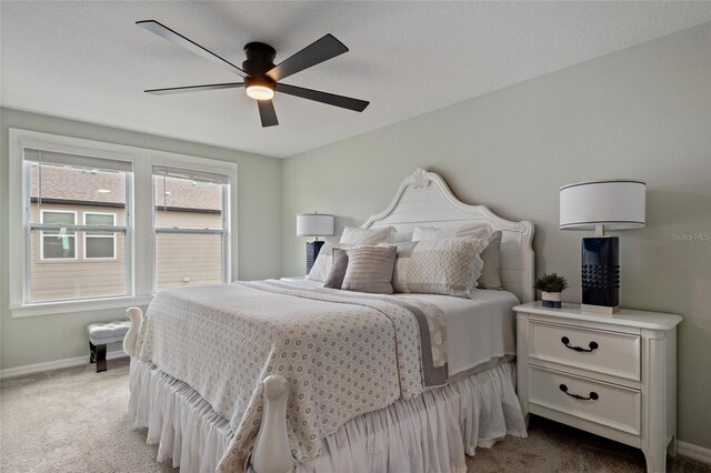 12330 Koshiba Aly, Orlando, FL 32827 - bedroom featuring baseboards, a ceiling fan, and light colored carpet