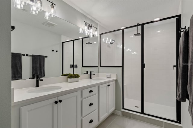 12330 Koshiba Aly, Orlando, FL 32827 - full bath with visible vents, a sink, a stall shower, and double vanity