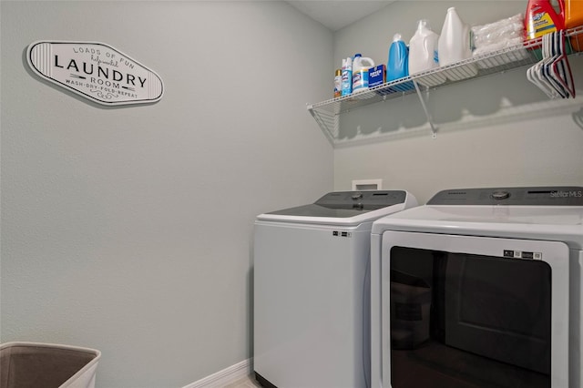 12330 Koshiba Aly, Orlando, FL 32827 - laundry area with washer and clothes dryer, laundry area, and baseboards