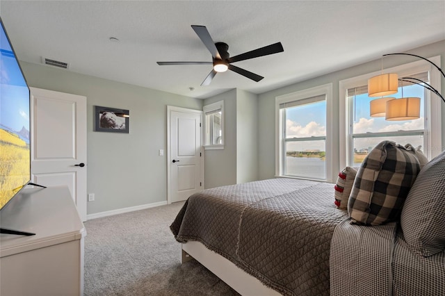 12330 Koshiba Aly, Orlando, FL 32827 - carpeted bedroom with visible vents, baseboards, and ceiling fan