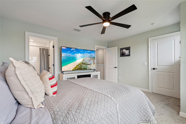 12330 Koshiba Aly, Orlando, FL 32827 - bedroom with ensuite bathroom, visible vents, baseboards, ceiling fan, and carpet floors