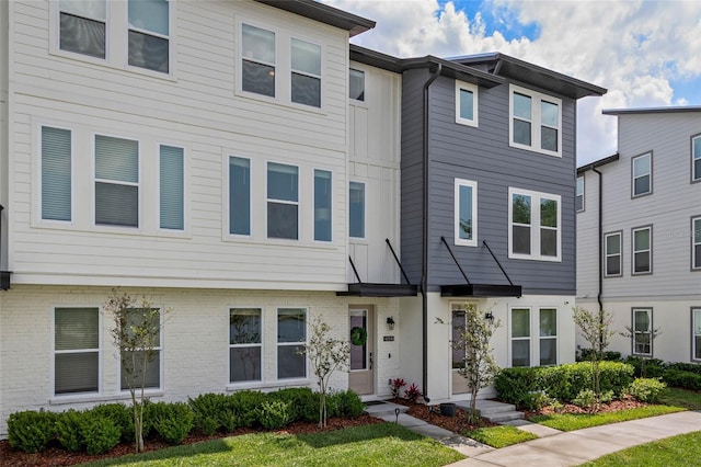 12330 Koshiba Aly, Orlando, FL 32827 - townhome / multi-family property with brick siding