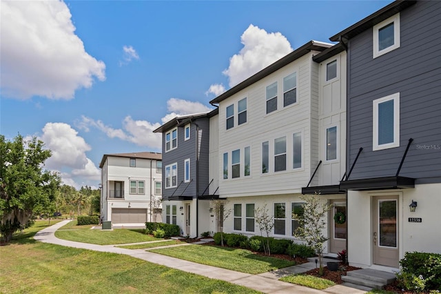 12330 Koshiba Aly, Orlando, FL 32827 - view of property with a residential view and a front yard