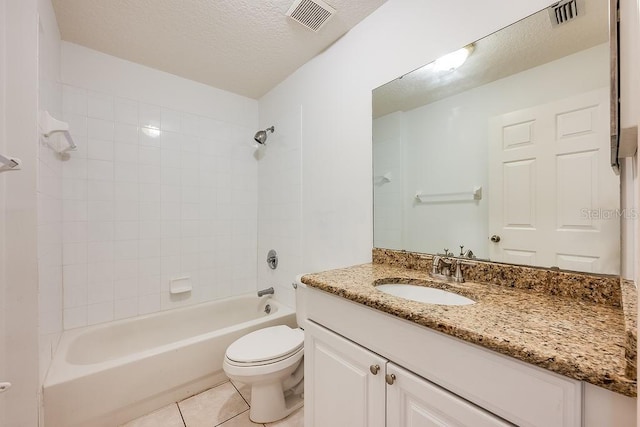 39900 Bayview Dr, Lady Lake, FL 32159 - bathroom with toilet, a textured ceiling, tile patterned floors, and visible vents