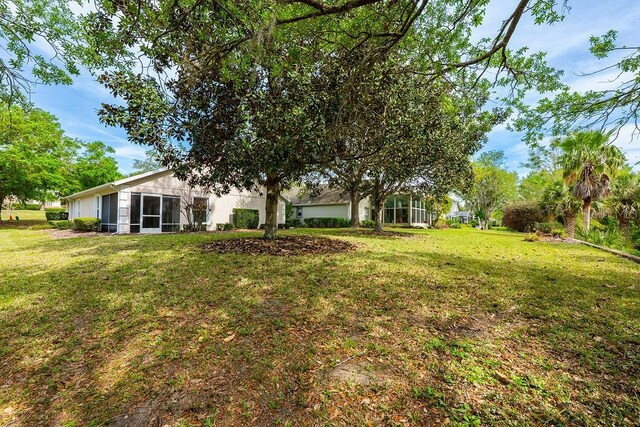 39900 Bayview Dr, Lady Lake, FL 32159 - view of yard with a sunroom