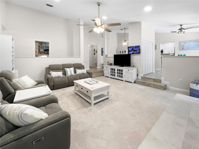 11404 Lokanotosa Trl, Orlando, FL 32817 - living room featuring high vaulted ceiling, baseboards, light colored carpet, visible vents, and ceiling fan