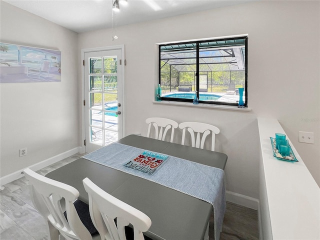11404 Lokanotosa Trl, Orlando, FL 32817 - dining room with baseboards and a ceiling fan