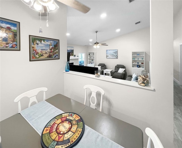 11404 Lokanotosa Trl, Orlando, FL 32817 - dining area with lofted ceiling, visible vents, recessed lighting, and a ceiling fan