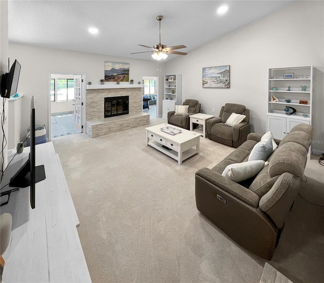 11404 Lokanotosa Trl, Orlando, FL 32817 - living area with lofted ceiling, a fireplace, a ceiling fan, and light carpet