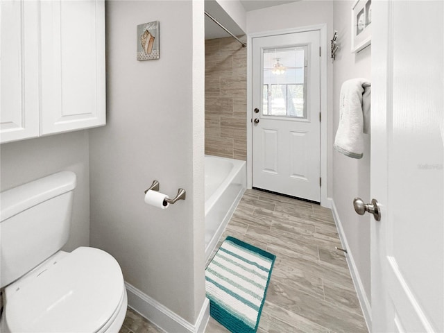 11404 Lokanotosa Trl, Orlando, FL 32817 - full bathroom with toilet and baseboards