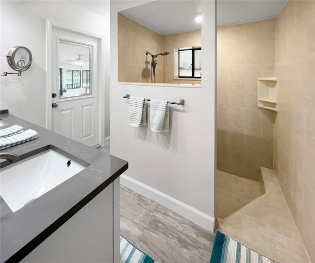 11404 Lokanotosa Trl, Orlando, FL 32817 - full bathroom featuring vanity, baseboards, and walk in shower