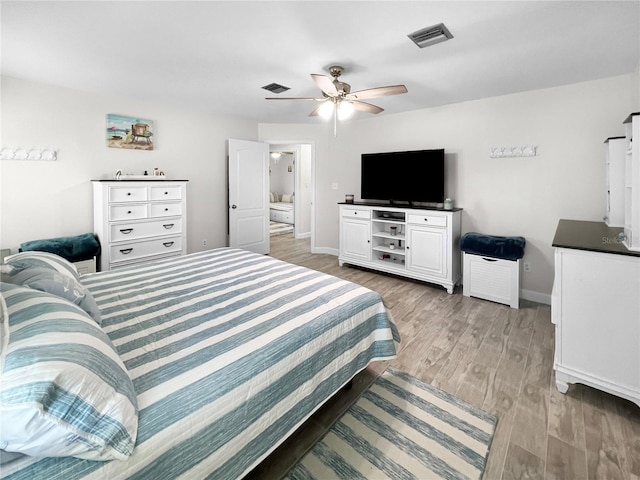 11404 Lokanotosa Trl, Orlando, FL 32817 - bedroom with baseboards, light wood-type flooring, and visible vents