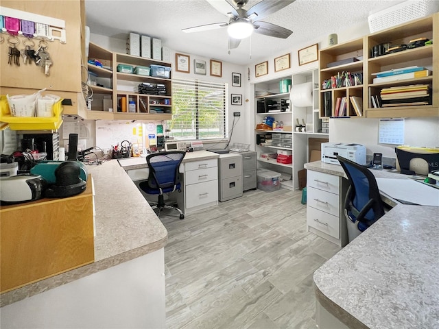 11404 Lokanotosa Trl, Orlando, FL 32817 - office area with a textured ceiling, built in desk, and ceiling fan