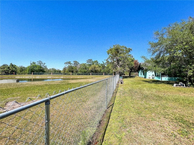 11404 Lokanotosa Trl, Orlando, FL 32817 - view of yard featuring a water view and fence