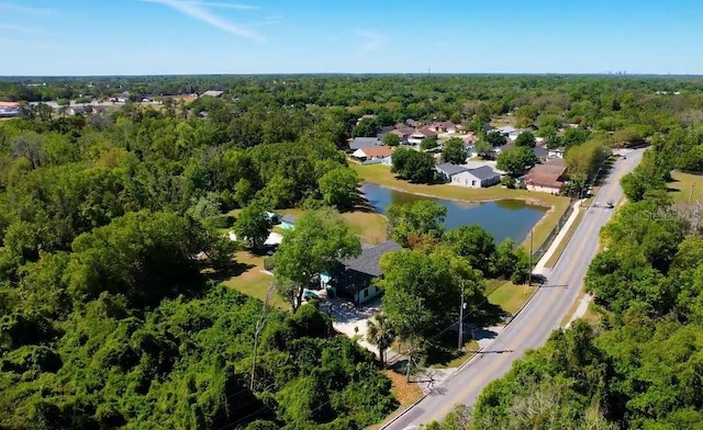 11404 Lokanotosa Trl, Orlando, FL 32817 - drone / aerial view with a water view and a view of trees