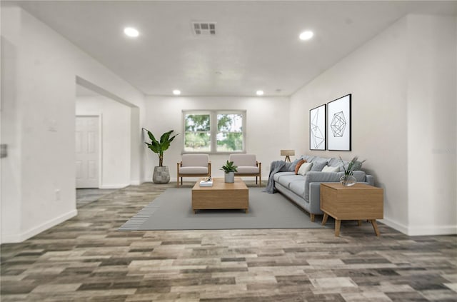 4385 Cassius St, Orlando, FL 32811 - living room featuring recessed lighting, baseboards, and wood finished floors