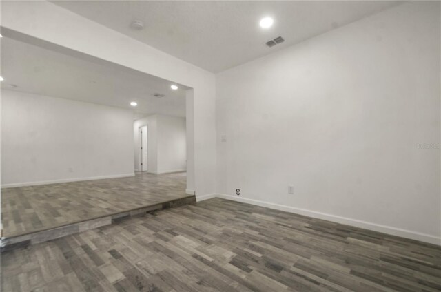 4385 Cassius St, Orlando, FL 32811 - spare room with wood finished floors, recessed lighting, and baseboards