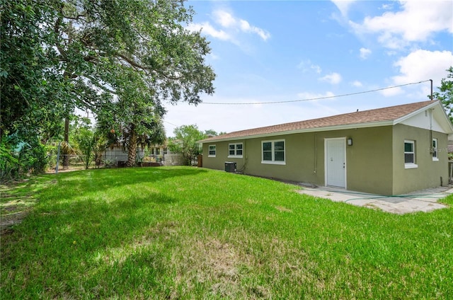 4385 Cassius St, Orlando, FL 32811 - view of yard featuring central AC