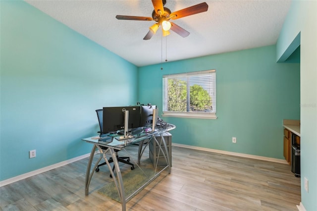 534 Wilton Cir, Sanford, FL 32773 - home office featuring baseboards, wood finished floors, ceiling fan, and a textured ceiling