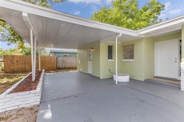 5201 Van Aken Dr, Orlando, FL 32808 - view of patio / terrace featuring a carport and fence