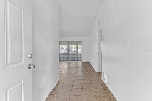 5201 Van Aken Dr, Orlando, FL 32808 - hall with light tile patterned flooring and visible vents